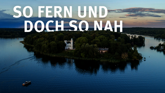 Luftbild der Pfaueninsel mit Schriftzug: So fern und doch so nah