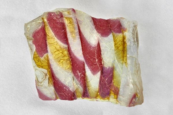 Johann Kunckel, fragments from the production of glass beads, 1685-1688, coloured glass, combed decoration on milk, ruby and yellow glass, Kunckel cabinet in Peacock Island Diary, on permanent loan from the Museum für Vor- und Frühgeschichte, Staatliche Museen zu Berlin, Prussian Cultural Heritage